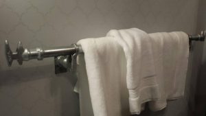 Container towel rod